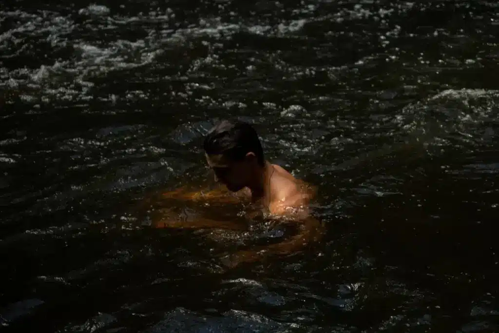 person near water