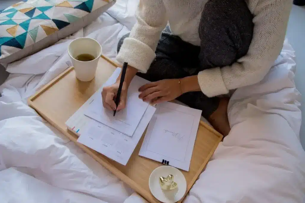 person journaling home