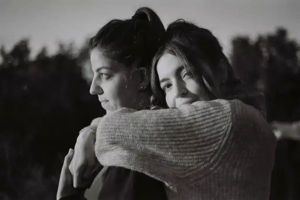 person comforting friend