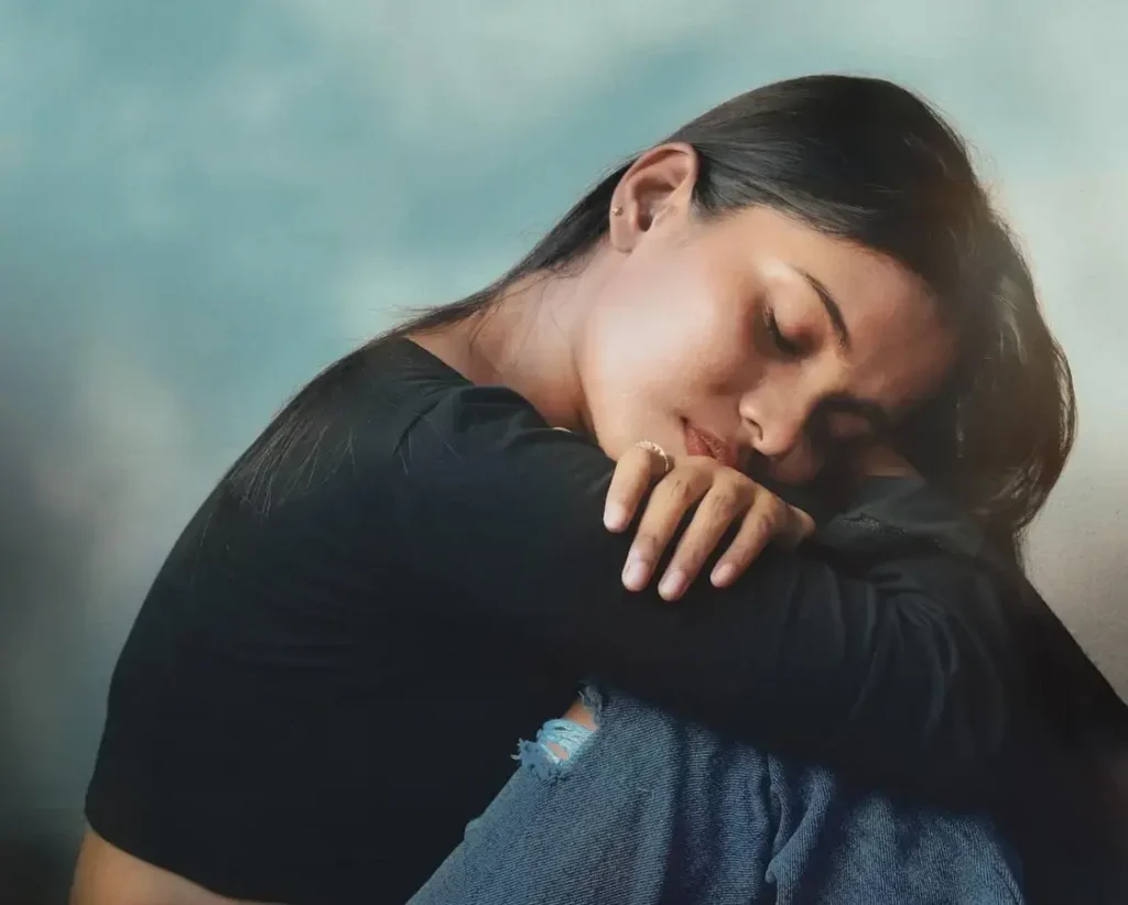 person comforting themselves